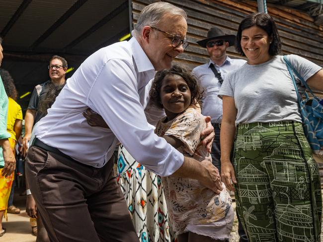 Mr Albanese embraces a young Yolngu child during Garma Festival at Gulkula on August 05, 2023 in East Arnhem, Australia. Picture: Tamati Smith/Getty Images