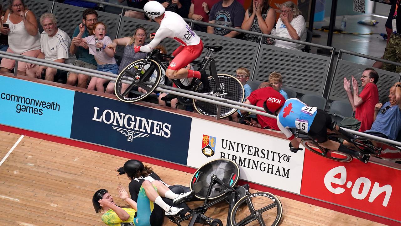 England’s Matt Walls goes over the barrier into the crowd.