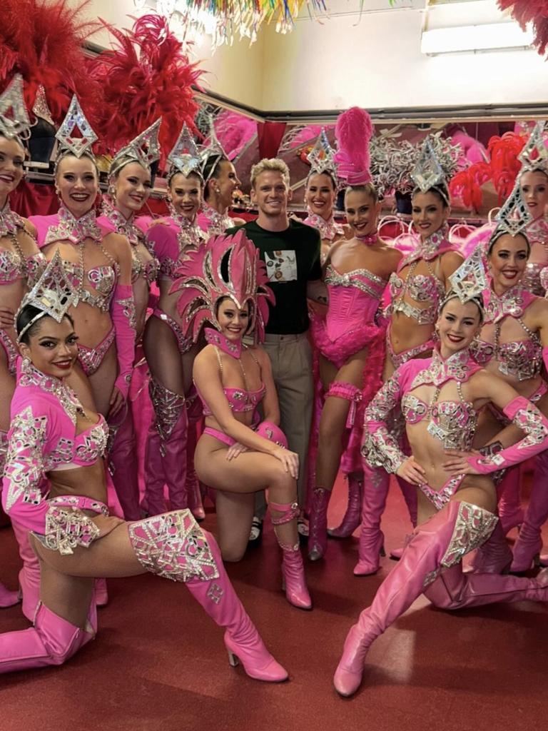 Former Australian swimmer Cody Simpson (centre) at the Moulin Rouge.