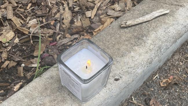 Heartbroken friends have lit a candle for the man. Picture: Keziah Sullivan/NINE NEWS