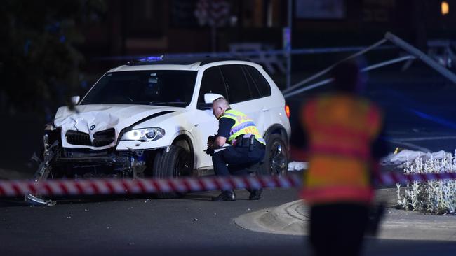 Police inspect a vehicle at the crash site at The Royal Daylesford Hotel. Picture: NCA NewsWire/Josie Hayden