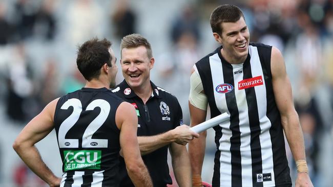 Nathan Buckley talking to Steele Sidebottom and Mason Cox after the win over Geelong. Picture: Getty