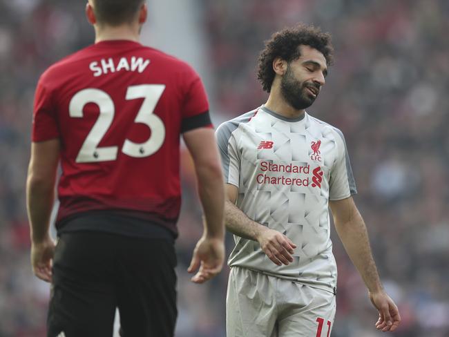 Liverpool's Mohamed Salah reacts at the end of the English Premier League soccer match between Manchester United and Liverpool at Old Trafford stadium in Manchester, England, Sunday, Feb. 24, 2019. (AP Photo/Jon Super)