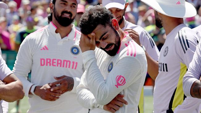 Virat Kohli with Indian teammates after losing the fifth Test at the SCG on Sunday. Picture: AFP