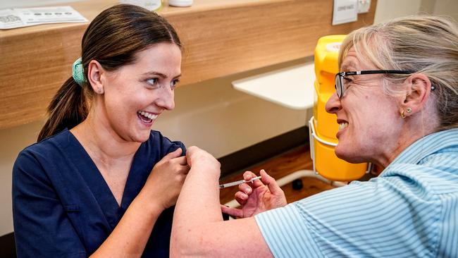 Women’s &amp; Children’s Emergency Department nurse Emily Hooper gets her Pfizer vaccination from Nurse Unit Manager Maryanne Attard on March 2, 2021. Photo: Mike Burton