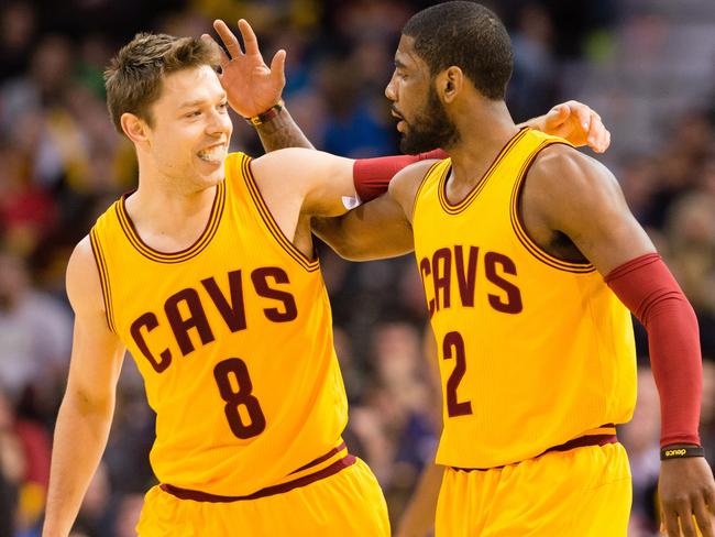 Matthew Dellavedova celebrates with Kyrie Irving.