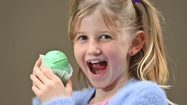 Eight-year-old Holly Stanley about to tuck into an iconic Balfours green frog cake. Picture: Keryn Stevens