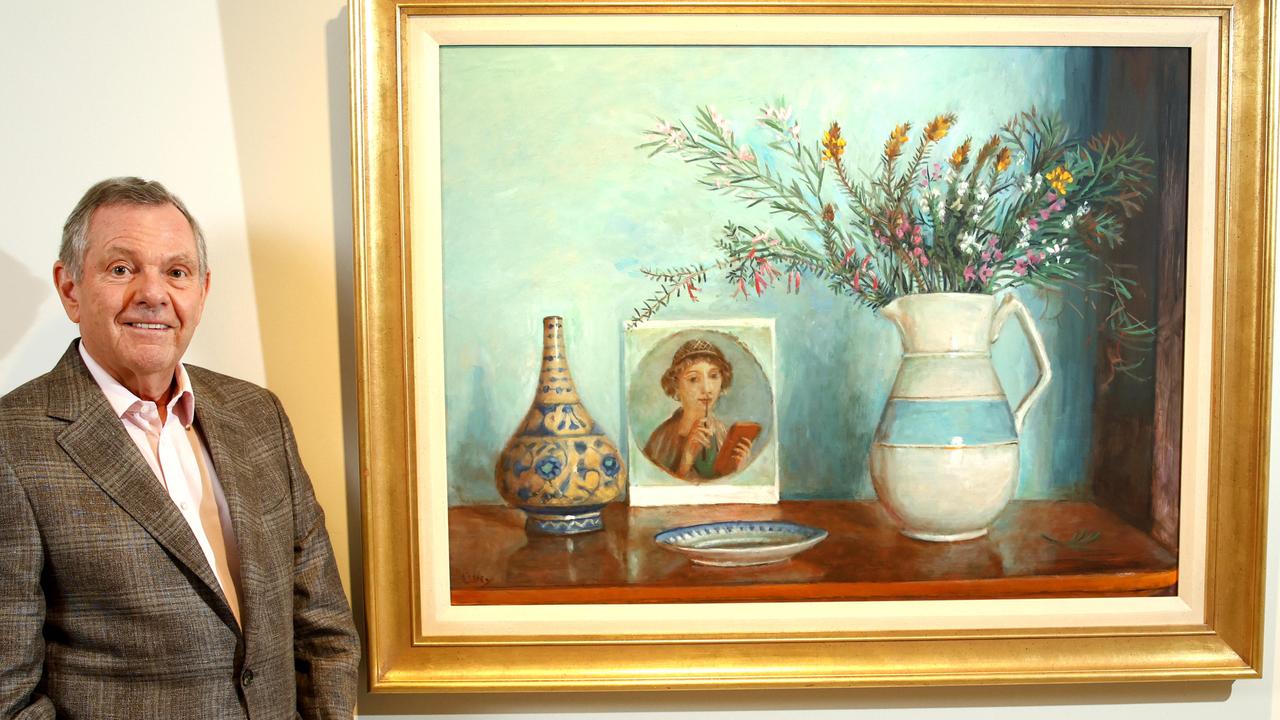 Philip Bacon with the Margaret Olley piece Sunday Flowers at his Fortitude Valley gallery. Picture: David Clark