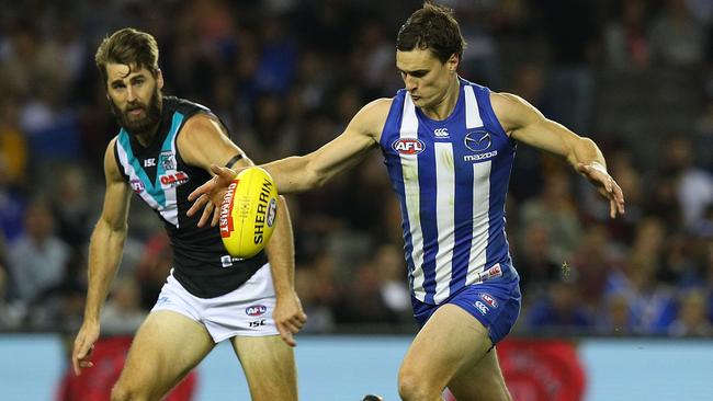 Scott Thompson gathers the ball ahead of Justin Westhoff.