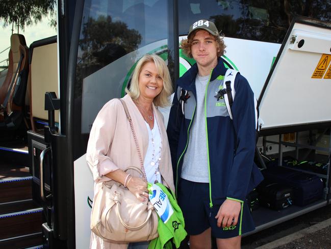 Kaylie Stuart, wife of Canberra Raiders coach Ricky Stuart, and son Jed, 18, board the family bus travelling to Sydney to watch the grand final. Picture: Kate Christian