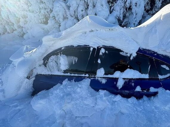 A car is enveloped by snow as storms caused havoc across the US. Picture: Reuters