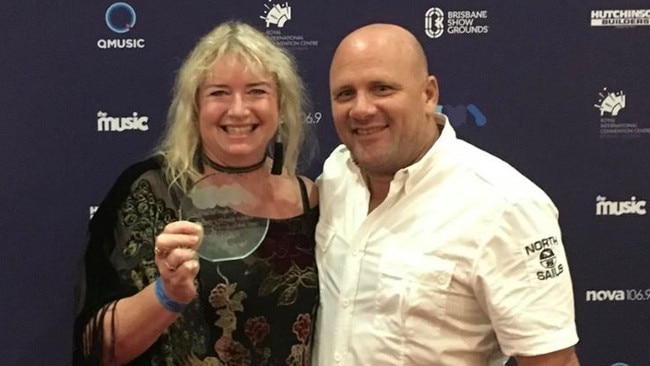 NightQuarter owners Michelle Christoe and Ian van der Woude with their award at the Queensland Music Awards.