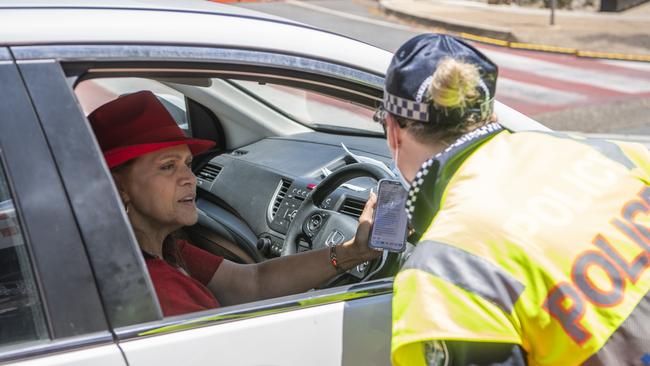 A woman is stopped at a police check on the NSW-Queensland border on Wednesday. Picture: Dan Peled