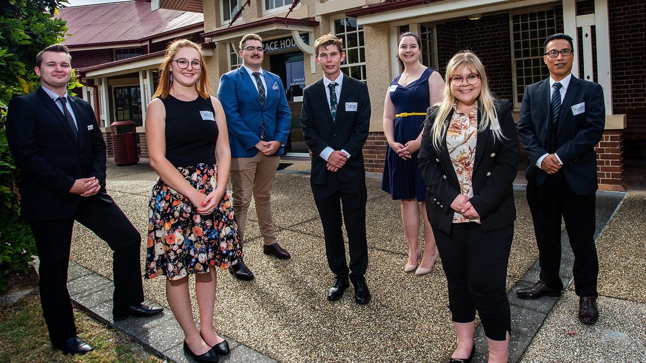 University of Southern Queensland law students (from left) Blair Stuart, Erin Lowry, Tory Webb, Jaidyn Paroz, Madelyn Dawson, Julia Keating and Bonifacio Arriabs outside Grace House.