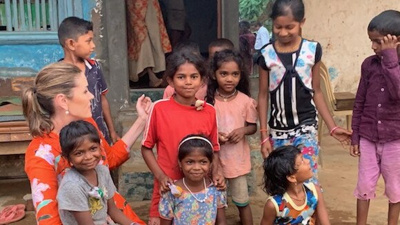 Peta Credlin with some of the children living in Mumbai, India, who will benefit from power generated by Queensland’s Adani mine. Picture: Supplied