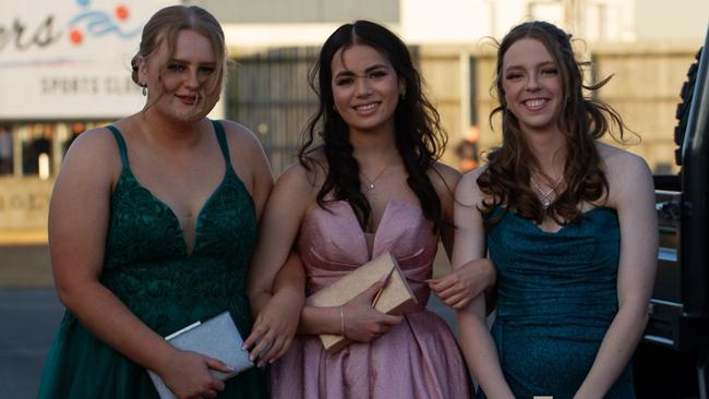 Abby Charteris, Tayissa Wormington and Holly Mitchelson at the 2023 Bundaberg State High School Formal.