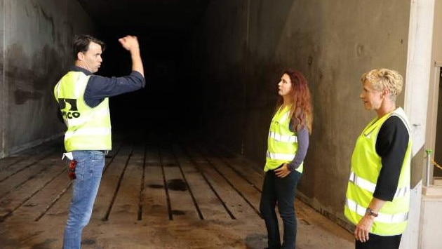 Soilco operations manager Mark Emery explains the organic waste drying process to Tweed Mayor Chris Cherry and Tracey Stinson.