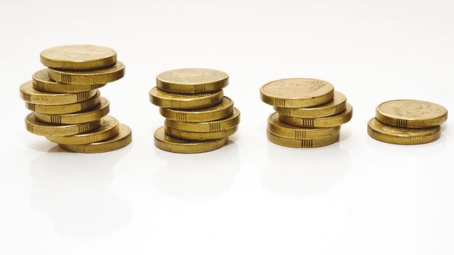 Untidy downward trending "graph" of well used Australian two dollar coins on a white background.