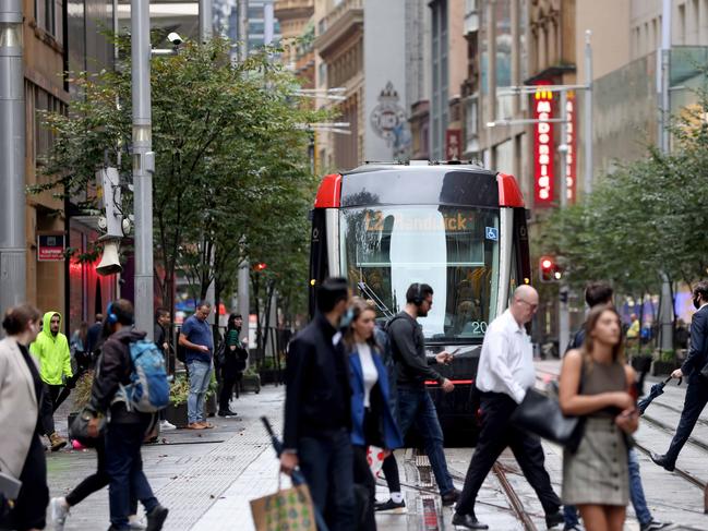 SYDNEY, AUSTRALIA - NewsWire Photos MAY 13, 2022:  People pictured on George Street in the Sydney CBD around 8am. Office worker numbers in the CBD on the rise.Picture: NCA NewsWire / Damian Shaw