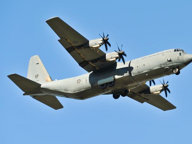 A RAAF Hercules fly over the Sawtell Swans vs Coffs Swans Game at C.ex Coffs International Stadium. Picture: Rob Wright / The Coffs Coast Advocate