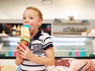 Portrait of a young boy enjoying an ice cream cone