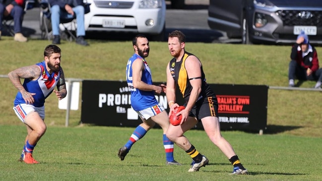 Lobethal midfielder Aidan Riley looks to kick during a Hills Football League match against Onkaparinga Valley at Lobethal. Picture: Aliza Fuller/Lobethal Football Club