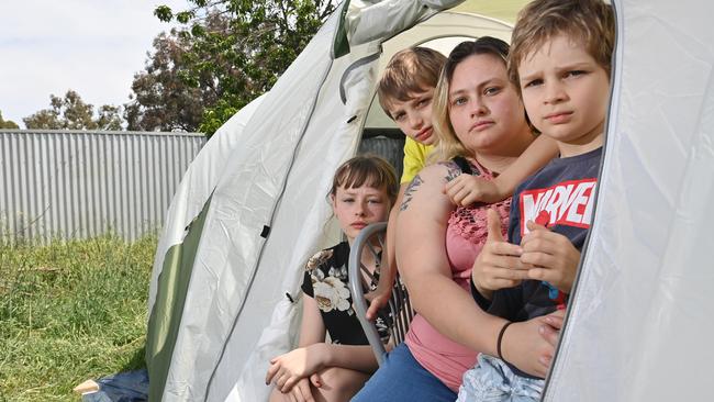 Sarah Wade, with children Allysha, Logan and Domenic, is a mum of four who has been on housing waitlist and lives in a tent in her mum's backyard. Picture: Keryn Stevens