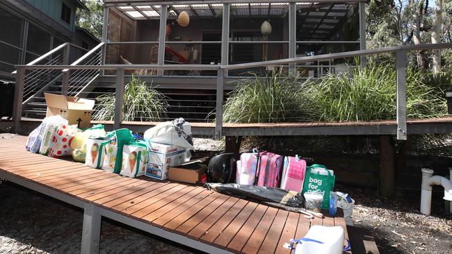 Residents pack up their belongings, ready to leave the island. Picture Glenn Hampson