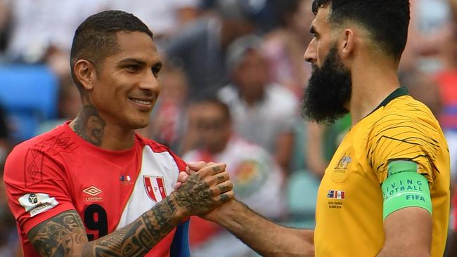 Australia's Mile Jedinak shakes hands with Paolo Guerrero of Peru during their final FIFA World Cup group match at Fisht Stadium during the FIFA 2018 World Cup in Sochi, Russia, Tuesday, June 26, 2018. (AAP Image/Dean Lewins) NO ARCHIVING