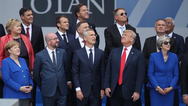 Donald Trump, Theresa May, Angela Merkel and other NATO leaders pose for ‘family photograph’ in Brussels on Wednesday. Picture: Getty Images.