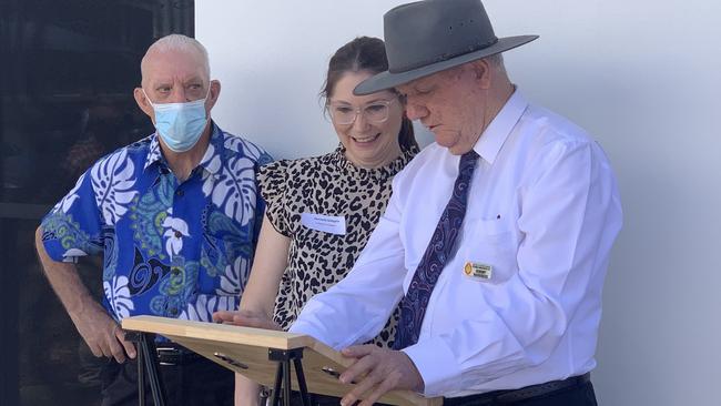 A large crowd gathered to celebrate the new home in South Mackay and Robert Mackenzie (right) and Frank Jensen (left) thanked those in attendance alongside house supervisor Danielle Gallagher. Picture: Duncan Evans