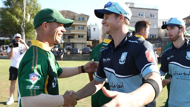 David Warner and Steve Smith shake hands after their grade cricket match.