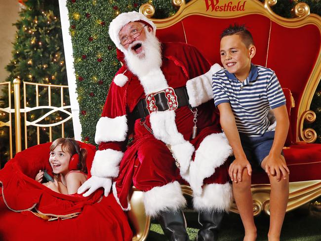 SUNDAY TELEGRAPH - 1/11/19Santa Clause in Westfield Bondi has a visit from Cooper Golder (10yrs) and his sister Imogen Golder (8yrs) who suffers from autism and has sensory issues. Picture: Sam Ruttyn