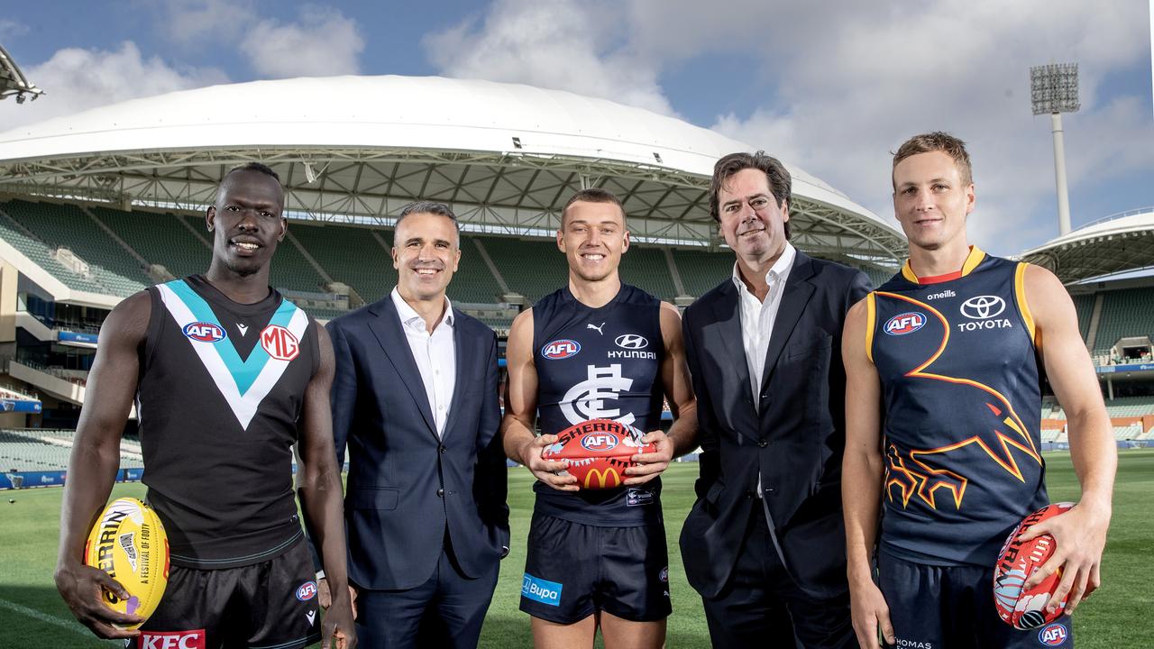 Gillon McLachlan, CEO of the AFL and the Premier of South Australia Peter Malinauskas stand with Aliir Aliir, Patrick Cripps of the Blues and Jordan Dawson of the Crows at Adelaide Oval this week. Photo by Sarah Reed/AFL Photos via Getty Images.