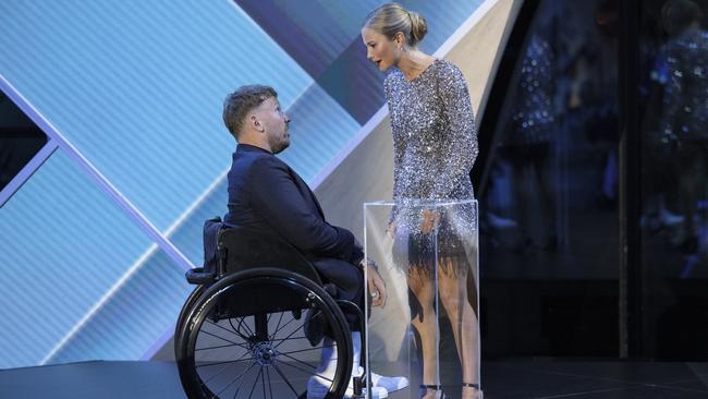 Australian of the year Dylan Alcott greets Grace Tame at the 2022 Australian of the Year Awards at the National Arboretum in Canberra, Australia.