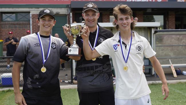 Brunswick coach Luke Money (centre) and co-captains Zane Attard and Keir Lucas lift the Craig Shield trophy. Picture: Valeriu Campan