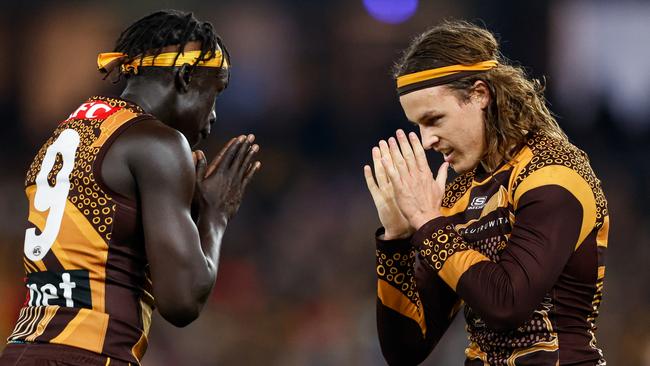 Jack Ginnivan (right) celebrates a goal with Hawks teammate Changkuoth Jiath. Picture: Dylan Burns/AFL Photos via Getty Images