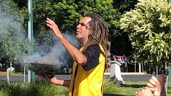 At Lismore Town Hall Gilbert Laurie presents a smoking ceremony ahead of the Australia Day Awards and Citizenship Ceremony. Photo: Alison Paterson