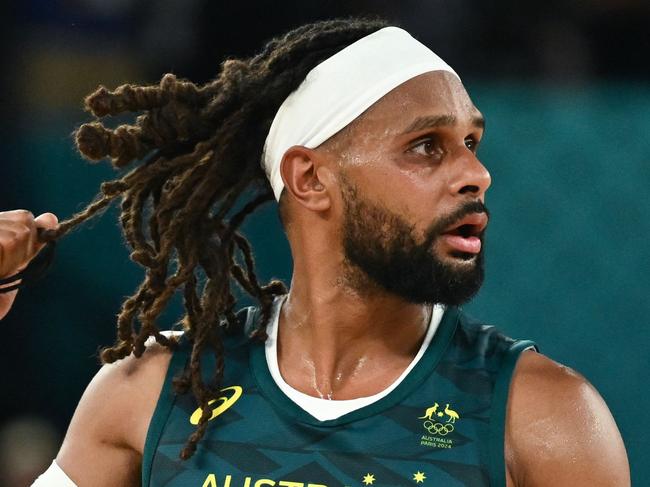 Australia's #05 Patty Mills reacts after in the men's quarterfinal basketball match between Serbia and Australia during the Paris 2024 Olympic Games at the Bercy  Arena in Paris on August 6, 2024. (Photo by Aris MESSINIS / AFP)