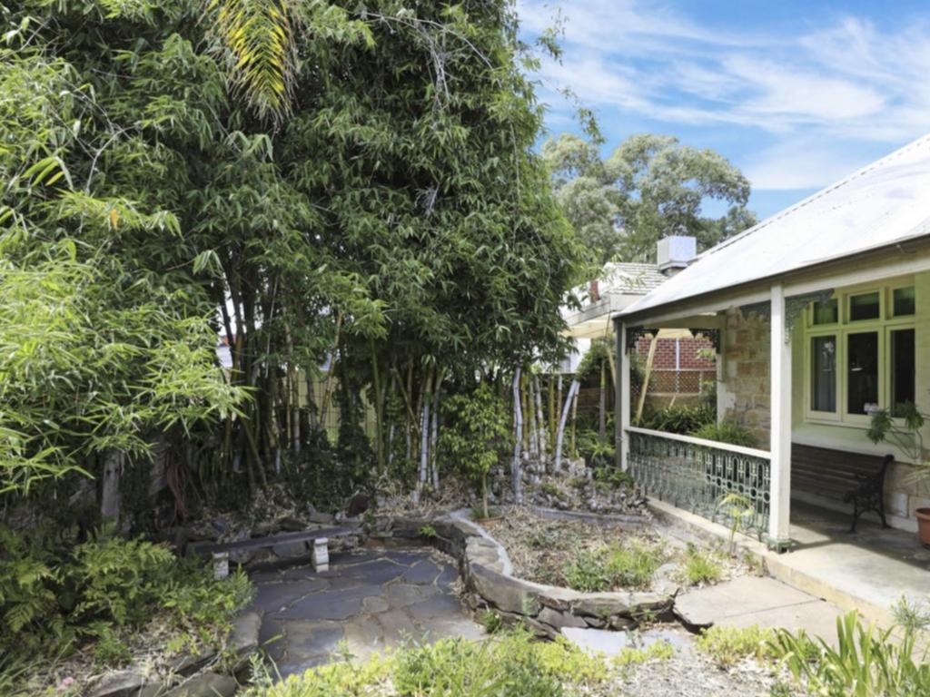 The home’s original front was covered in bamboo and messy foliage. Picture: Supplied.