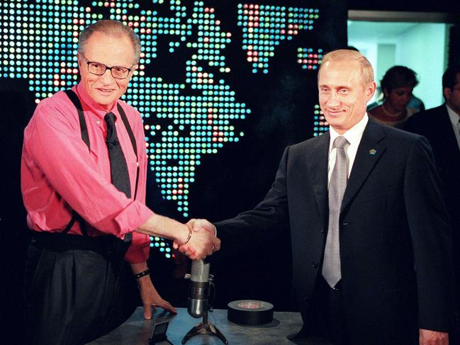 Larry King shakes the hand of Russian President Vladimir Putin before an interview in 2000. Picture: AFP