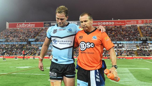 Matt Moylan is helped off the field after injuring his hamstring. Picture: Zak Simmonds