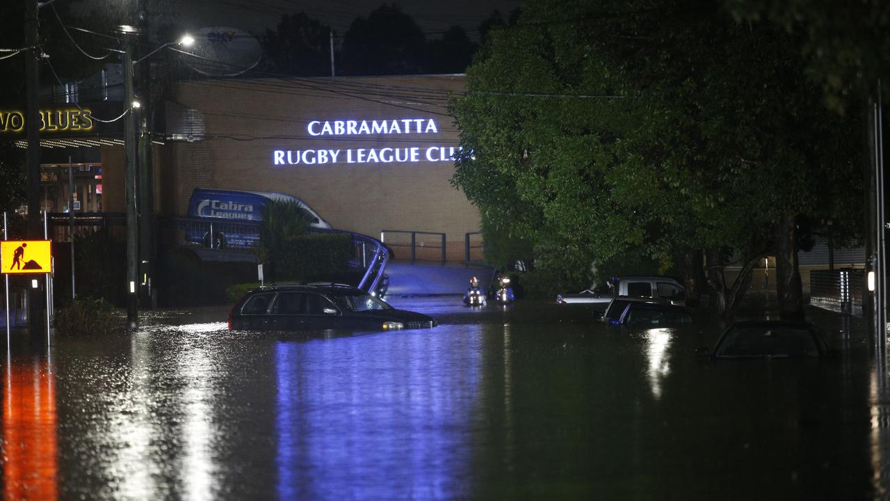 Cars flooded in Church street, Cabramatta. Picture: John Appleyard.