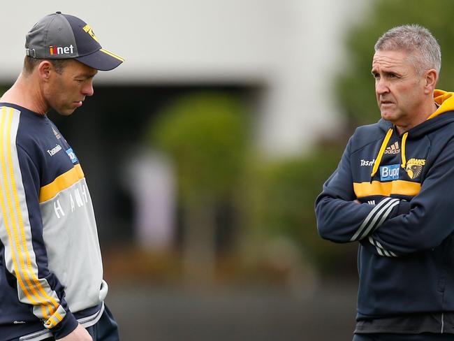 MELBOURNE, AUSTRALIA - SEPTEMBER 17: Alastair Clarkson, Senior Coach of the Hawks (left) and Chris Fagan, Football Manager of the Hawks share a discussion during the Hawthorn Hawks training session at the Ricoh Centre, Melbourne on September 17, 2015. (Photo: Michael Willson/AFL Media)