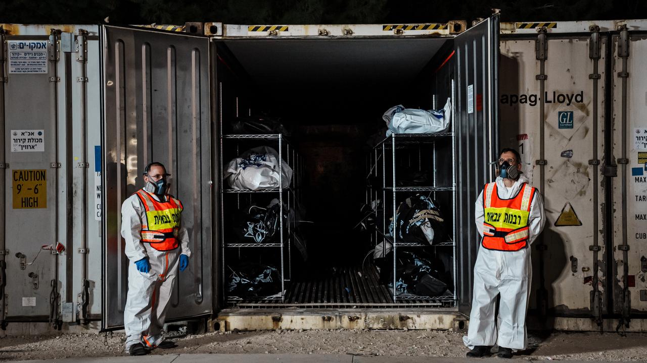 Bodies of civilians killed in the Hamas attack are collected, identified, placed in temporary storage and wait to be claimed by family members at a military base in Israel. Picture: Marcus Yam/Los Angeles Times