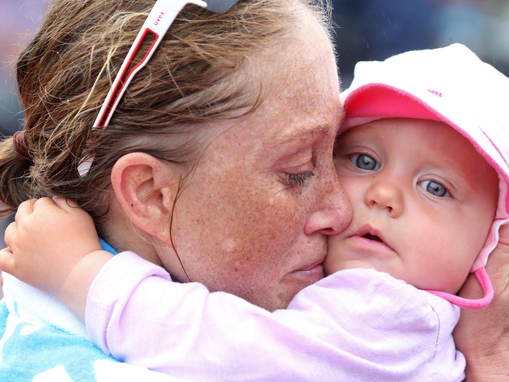 Ironman Cairns 2019 women's fourth place getter Kristin Liepold hugs her daughter Mira 1 year after she crossed the finish line PICTURE: ANNA ROGERS