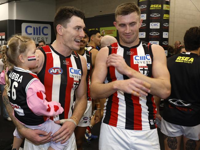 MELBOURNE, AUSTRALIA – AUGUST 25: Josh Battle of the Saints and his daughter are seen in the rooms after the round 24 AFL match between Carlton Blues and St Kilda Saints at Marvel Stadium, on August 25, 2024, in Melbourne, Australia. (Photo by Darrian Traynor/Getty Images)