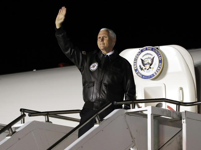 Vice President Mike Pence waves as he boards air force Two. Picture: AP