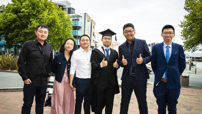 Xinzi Zhang with friends. University of Tasmania Graduations. Federation Concert Hall, Hobart. Picture: RICHARD JUPE
