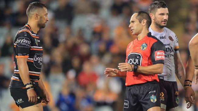 Referee Ashley Klein talks to Tigers Captain Benji Marshall after he awarded a penalty to the Broncos in Golden Point extra time.